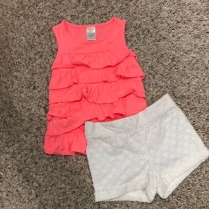 Pink ruffle top with white lace shorts